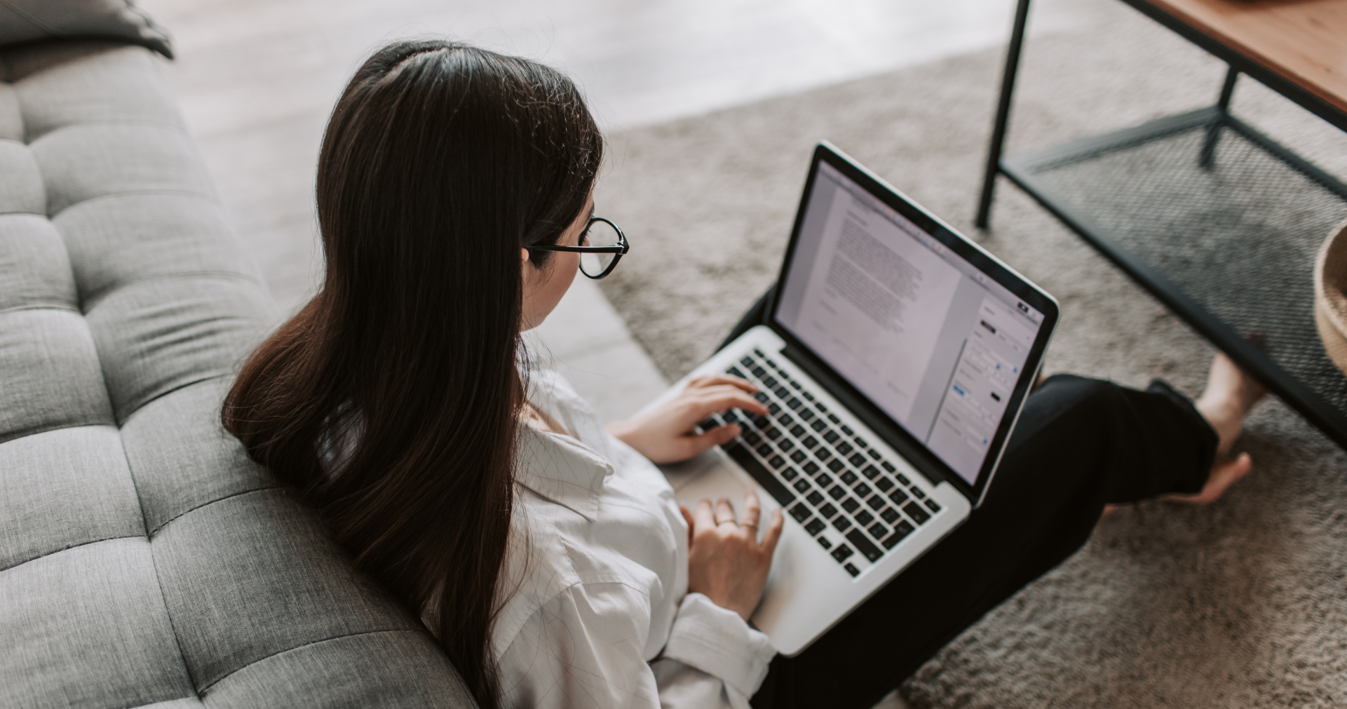 Woman Sitting on Floor with laptop